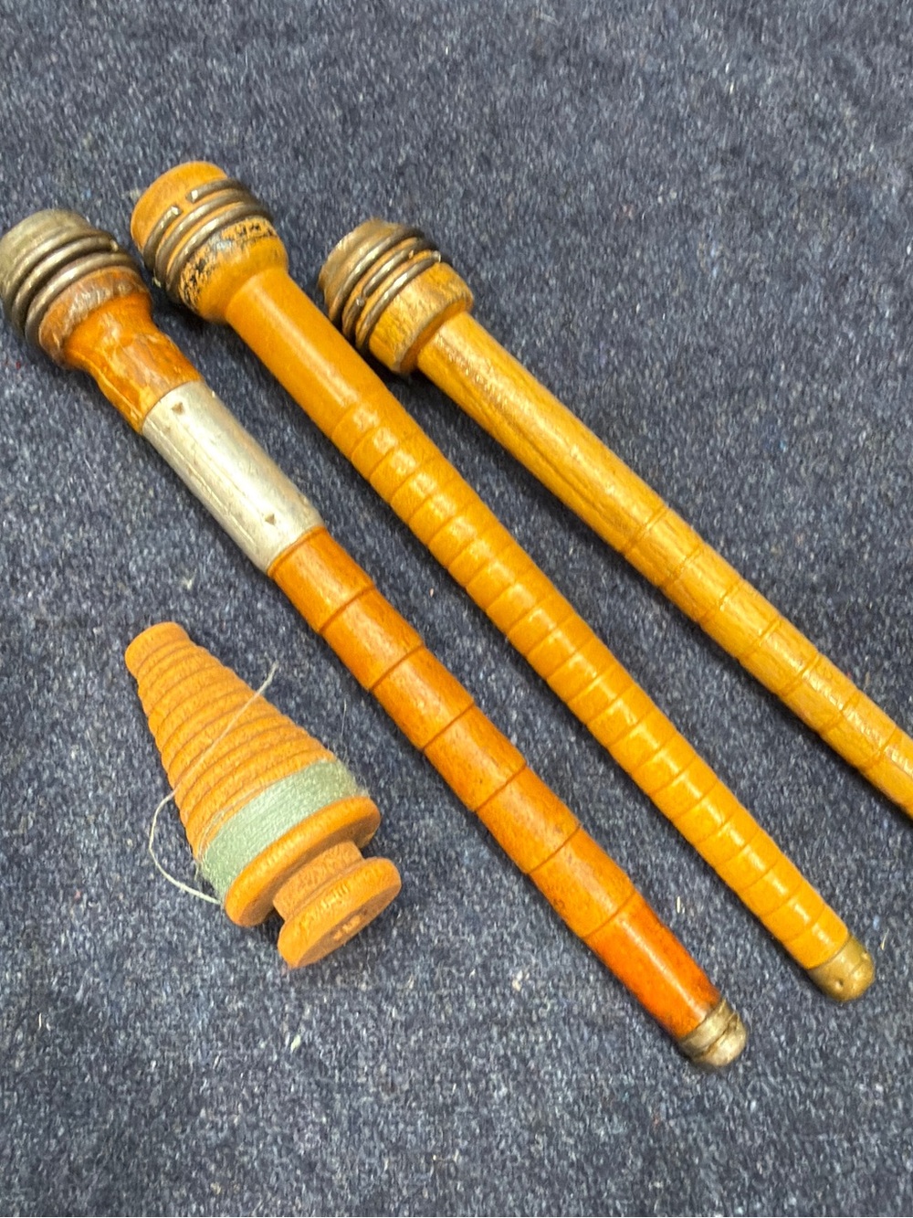 Antique wooden textile mill bobbins quills from industrial loom
